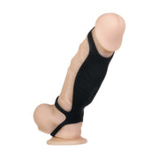The Rocketeer Vibrating Penis Enhancer Sheath is a realistic, body-safe silicone cock sheath with a suction base and a black harness-style sleeve, shown against a white background.