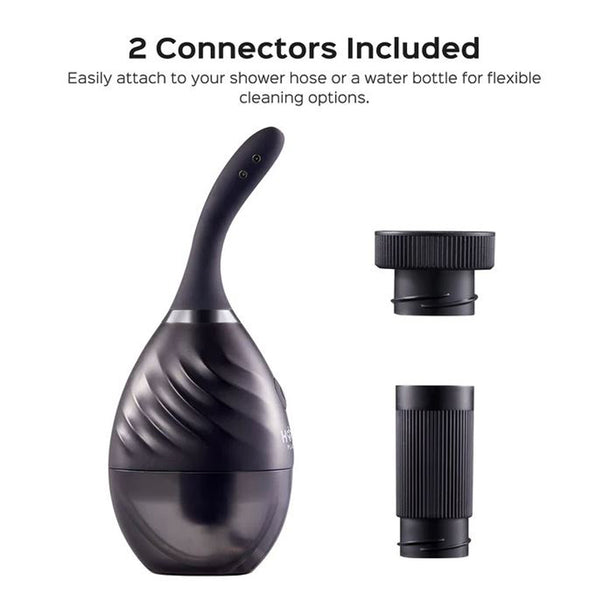 The Bulby Auto Spray Anal Douche System by Honey Play Box is shown in black with an egg-shaped design and curved spout, alongside two black connectors. Text reads, "2 Connectors Included" for shower hose or water bottle attachment.