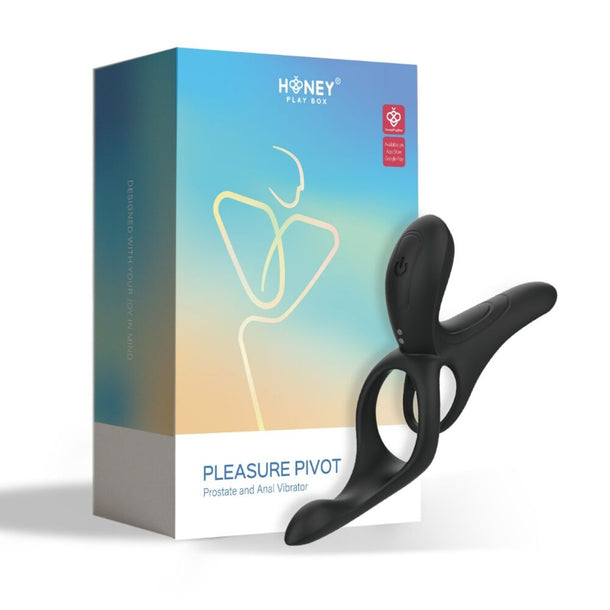 A black Pleasure Pivot Vibrating Cock Ring with Clit Stimulator is shown in front of a colorful "Honey Play Box Pleasure Pivot" box featuring minimalist line art.