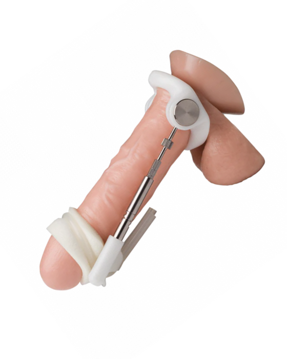 A Male Edge Jes Penis Extender Original - Natural Traction Penis Enlarger (Copy) with metallic joints and white bands, held against a white background.