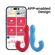 Image shows a smartphone with an app displayed on the screen featuring various control modes labeled "Official Mode," "Free Touch," "Music Mode," and "Long-distance Control." In front of the phone, there are Honey Play Box's Joi App Controlled Thrusting Vibrators With Tongue in red and blue. Text reads "APP-enabled Design.