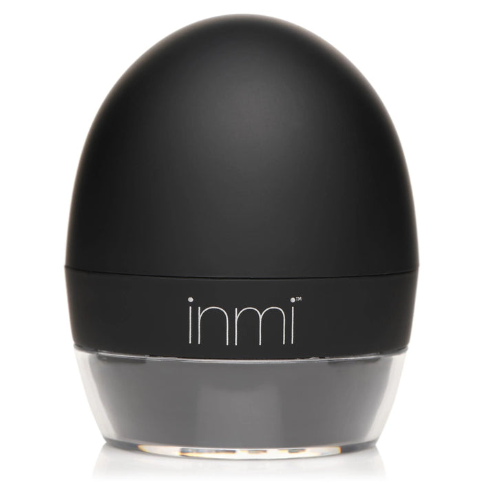 A small, black, egg-shaped object with a clear base, featuring the brand name "XR Brands" written in white text on the front. Named the Lady Licker Rotating Tongue Stimulator with Discreet Case, this device is made from premium silicone and USB rechargeable; its sleek and modern design is also waterproof.