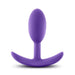 The Luxe Small Wearable Silicone Vibra Slim Plug - Purple by Blush is expertly crafted from hypoallergenic silicone. It boasts a smooth, bulbous tip and a curved base designed for comfort and safety. This sleek, seamless anal toy offers both style and peace of mind.