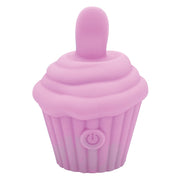The Cake Eater Clitoral Stimulator Tongue Vibrator in pink is a silicone device shaped like a cupcake, with a rounded tip on top and a power button symbol on the side.