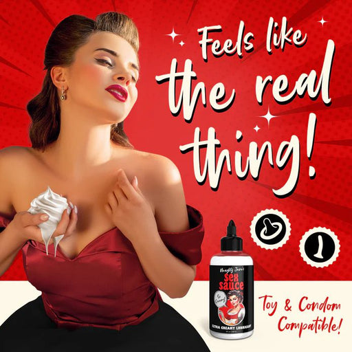 A retro-styled woman in a red dress seductively touches her chest with whipped cream, looking upwards. The poster showcases a bottle of "Naughty Jane's Creamy Cum Sex Sauce Lubricant 8oz" by XR Brands and emphasizes its toy compatible, body-safe formula with the tagline "Feels like the real thing!" against a vibrant red background.