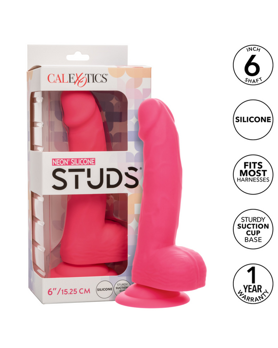 The image shows a neon-hued delight from CalExotics, labeled as the "Silicone Stud 8 Inch Suction Cup Dildo - Pink." Made of body safe silicone, it measures 8 inches, fits most harnesses, and has a powerful suction cup base. The partially open packaging showcases the dildo. The product comes with a 1-year warranty.
