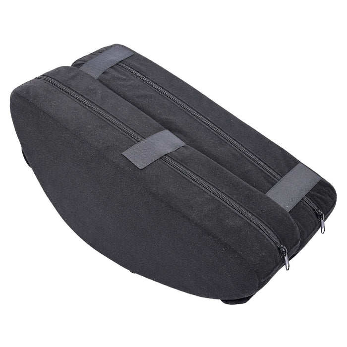 The Pivot Convertible Sex Toy Mount & Cushion by Sportsheets is a sleek, black, wedge-shaped travel accessory with two zippered compartments. It features a compact design for easy storage in tight spaces. Additionally, two grey straps on the top provide added support or can be used to secure extra items.