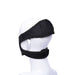 The Pivot Face Sitting Strap On Harness from Sportsheets is displayed on a white mannequin head. The black strap wraps around the head and chin, securing with adjustable Velcro fastenings. Its sleek, compact design ensures a comfortable fit, allowing you to experience restful sleep without interruptions.