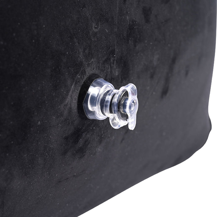 A close-up image of a clear, plastic air valve on the black surface of the Pivot Plus Large Inflatable Sex Positioner Wedge Cushion by Sportsheets. The valve is firmly closed and appears to be seamlessly integrated into the side of the cushion.