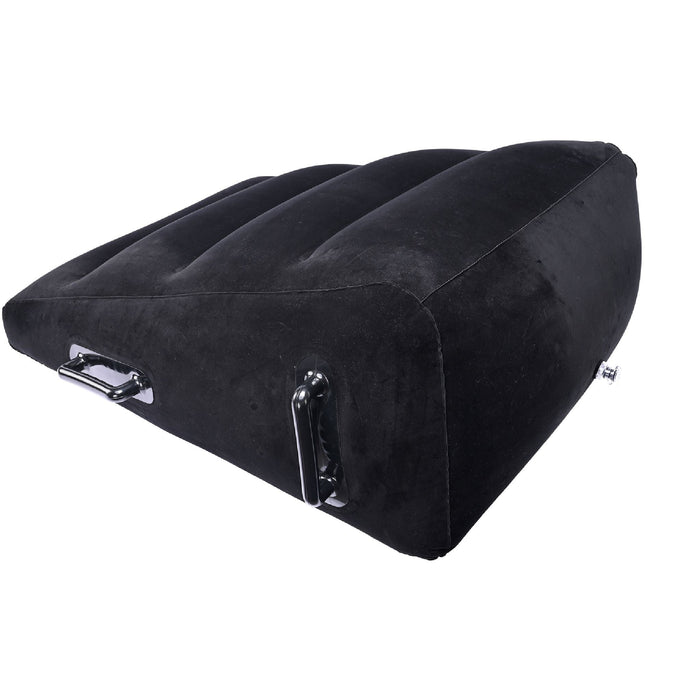 The Pivot Plus Large Inflatable Sex Positioner Wedge Cushion by Sportsheets is a black, wedge-shaped cushion with vertical grooves. It includes handles on either side and a valve for easy inflation or deflation. The surface boasts a soft, velvety texture for added comfort.