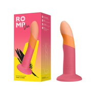 A pink and orange silicone Romp Dizi Ultra Smooth 7 Inch Dildo with a curved tip and suction cup stands upright beside its colorful packaging displaying the product name and details.