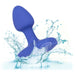 The Cheeky Gems Small Rechargeable Vibrating Butt Plug in blue makes a splash in clear water, droplets and waves forming against a white background.