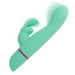 The Love Bunny Rockin’ G Triple Motor Rabbit Vibrator, shown in turquoise with a pink-accented handle, features a curved shaft and smaller extension for dual stimulation. Blurred motion lines indicate its triple motors vibrating against a white background.