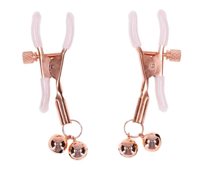 The Peaches 'n Cream Pearl Nipple Clamps with Bells are gold-colored, adjustable clamps with white silicone tips and small gold jingle bells, shown on a white background.