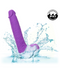 A CalExotics Silicone Stud Gyrating & Thrusting 9.5 Inch Purple Dildo with a realistic design is partially submerged in water, creating splashes around it. Made from silky silicone, it features a circular badge in the top right corner indicating that the product is waterproof with an IPX7 rating, meaning it is submersible.