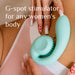 A person holding a light blue Snail Gizi Compact Ultra Powerful 2 Motor Dual Stimulating Vibrator by Snail Vibe against their chest. The individual has long, manicured nails with intricate red and white nail art. Text on the image reads, "Snail Vibe: Ultimate G-spot stimulator for every woman." Experience dual stimulation like never before.