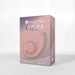 The image shows a box labeled "Snail Gizi Compact Ultra Powerful 2 Motor Dual Stimulating Vibrator - Pink" by Snail Vibe. The box depicts a long, curved object with a spiral design, indicative of the dual stimulation vibrator inside. The text on the box includes the tagline "Unroll your customizable pleasure." The background is plain and light-colored.