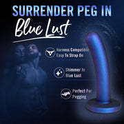 The Blush Surrender Intermediate 5.75 Inch Silicone Beginner & Pegging Dildo stands out with highlighted features: "Harness Compatible, Easy to Strap On, Shimmer in Blue Lust, Perfect for Pegging." Made from body-safe silicone for secure play. In the background, a couple embraces under the headline "Surrender Peg In Blue Lust.