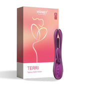 A purple Terri App-Controlled Kinky Finger Tapping Rabbit Vibrator, designed for optimal g-spot stimulation, is displayed beside its packaging box. The box features the brand "Honey Play Box" and the product name "Terri" on a pink and white gradient background, with a minimalist line drawing of a woman and a heart logo indicating an award.