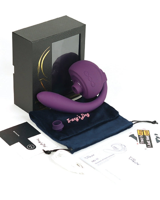 A purple waterproof Tracy's Dog OG 3 Clitoral Suction & G-Spot 2 in 1 Vibrator in a box.