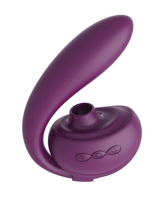 A sleek, purple modern Tracy's Dog OG 3 Clitoral Suction & G-Spot 2 in 1 Vibrator with a curved design for ergonomic comfort.