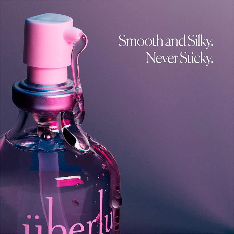 A 50 ml UberLube Premium Silicone Lubricant bottle with a pump dispenser sits against a purple background. Text reads: "Smooth and Silky. Never Sticky. Long lasting lube for an anti-chafe experience.