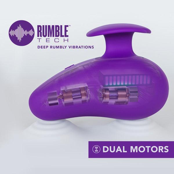 Image of a purple vibrating massage device branded with "Blush" and named the "Wellness Palm Sense Rumbly External Vibrator with Finger Hold," featuring the slogan "Deep Rumbly Vibrations." This ergonomic silicone vibrator showcases dual motor technology through a transparent section, highlighting its advanced mechanics. It is also waterproof and rechargeable for ultimate convenience.
