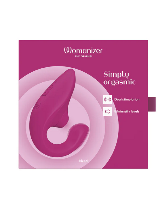 The Womanizer Blend Pleasure Air Clitoral & G-Spot Rabbit - Pink packaging showcases the product, a pink dual-stimulation device. The predominantly pink box with white circular patterns highlights features like "Simply orgasmic," "Dual stimulation," and "8 intensity levels." This rabbit vibrator offers blended orgasms for ultimate pleasure.