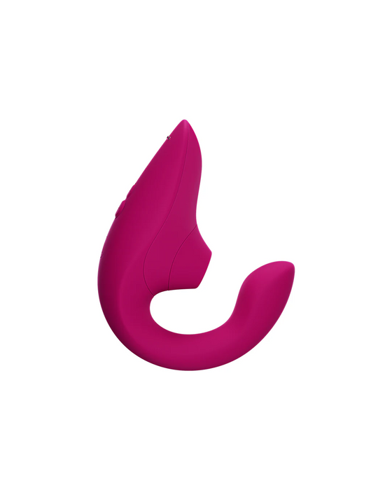 A Womanizer Womanizer Blend Pleasure Air Clitoral & G-Spot Rabbit - Pink with a sleek, curved design featuring two ends—one thicker and one thinner—intended for dual stimulation. The device is smooth, seamless, and designed for internal and external comfort and effectiveness.