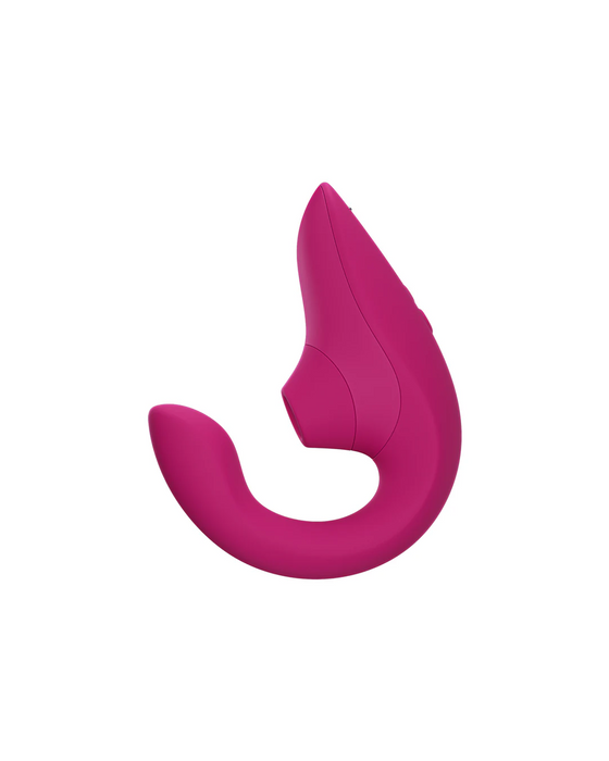 A Womanizer Womanizer Blend Pleasure Air Clitoral & G-Spot Rabbit - Pink with a sleek design, featuring soft, rounded edges and a smooth texture. The device offers dual stimulation with its flexible, ergonomic shape designed for comfort and ease of use.