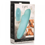 Box of a Wave Slider Remote Control Vibrating Humping Pad. Image displays the pad, remote, and illustrations showing its use for orgasmic and anal stimulation on a white background.
