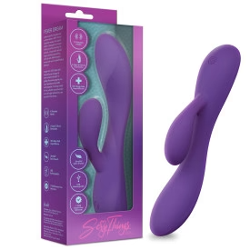 Purple UltraSilk satin-smooth silicone rabbit vibrator with a curved shaft and flexible teaser, next to its packaging.