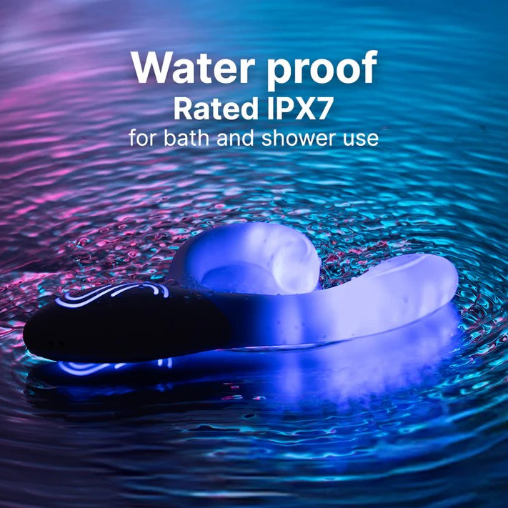 Waterproof Illumination Rabbit LED vibrator, white with glowing blue light, partially submerged in water.