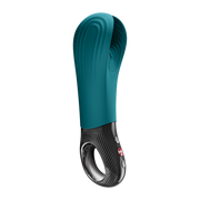 Teal silicone Fun Factory Manta penis stroker with open-wing design, black base, and red control buttons.