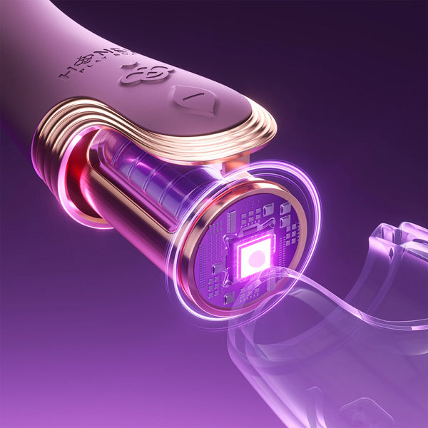 A close-up of the Fling Powerful Licking Vibrator with App Control, featuring a glowing purple LED, exposed circuit board, metallic gold and translucent parts, set against a purple background.
