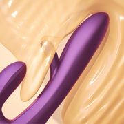 Abstract digital artwork with smooth, curved shapes in purple and translucent gold tones, inspired by the sleek design of the Terri App-Controlled G-Spot Tapping Rabbit Vibrator - Purple, featuring flowing effects and glossy textures.