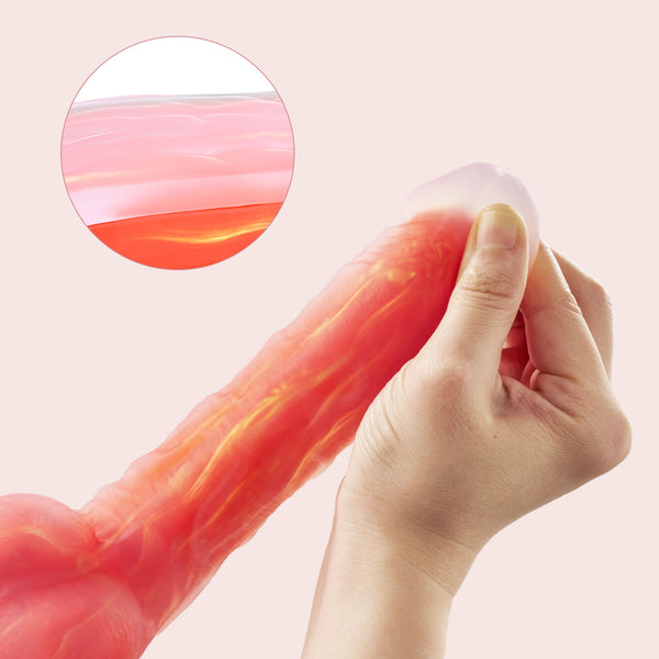 A hand stretches the translucent, pink Noctura Thrusting Silicone Dildo with App Control. An inset displays a close-up of its layered, jelly-like silicone texture.