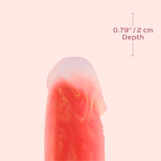 A close-up of the Noctura Thrusting Silicone Dildo with App Control, a pinkish-red waterproof vibrator featuring a translucent tip. The image shows "0.79\" / 2 cm Depth" with a vertical line marking the depth against a pale pink background.