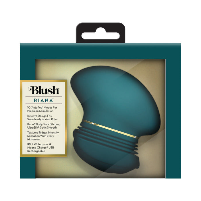 A teal Riana Circular Clitoral Rubbing Vibrator made from body-safe silicone with a gold accent, displayed in a box featuring a clear window and product info on the left side of the packaging.