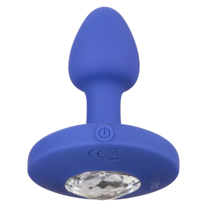The Cheeky Gems Small Rechargeable Vibrating Butt Plug in blue silicone features a sparkling clear crystal base and easy power button—perfect for adding some sparkle to your backdoor play.