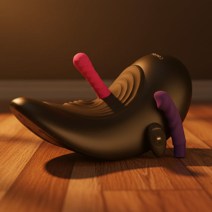 The Cowgirl Saddle Sex Machine with Vibration, Thrusting, and Rocking—featuring a black curved seat with pink and purple silicone dildos—rests on a wooden floor in warm light, offering hands-free pleasure and self-rocking motion.