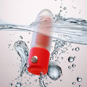 Red and clear lipstick vibrator, waterproof, submerged in splashing water.
