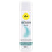 Pjur Woman Nude Water-Based Personal Lubricant 100 ml comes in a white bottle with a yellow logo, blue text, and teal accent. The label notes it's for sensitive skin and free from glycerin, parabens, and preservatives.