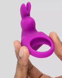 Happy Rabbit Vibrating Cock Ring Kit with Bunny Ears held in model's hand 